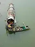 Poyang Lake fisherman who lives and feeds himself on a small fishing boat all year round