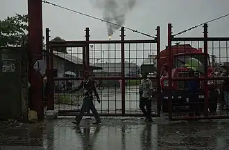 Port Harcourt oil refinery gates.