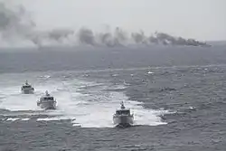 The hulk of the retired fast attack craft BRP Dionisio Ojeda (PC-117) burns after being hit by a Spike-ER missile launched from an MPAC Mk. III attack boat during a live fire demonstration held in November 2018 off the coast of Bataan.