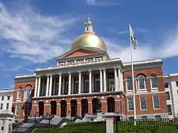 The front of the Massachusetts State House in bright daylight
