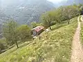 Mount Tavagnone, Salvadori agricultural fund and in the background the village of Bollone