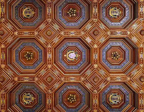 The ceiling of the ballroom, designed by Philibert de l'Orme, with the symbols of Henri II and his mistress Diane de Poitiers: "HD" cyphers, three interlaced crescent moons, and Henri II's main cypher: a crowned H above a crescent moon