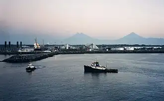 Puerto Quetzal seen at dawn, with the volcanoes on the horizon