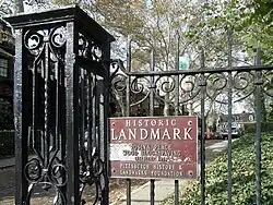 Photo of the Historic Landmark sign on the entrance to Roslyn Place
