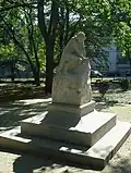 Seated girl sculpture