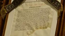 The pontifical decree of canonical coronation Qui Semper granted for the "Virgin of Hope of Triana" in Spain, legally imposing the venerated Marian image the Pontifical right to wear a crown by Pope John Paul II on 7 April 1983