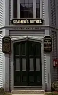 Plaques at the doorway, as seen in 1968