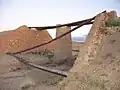 The remaining steel joists and abutments of a bridge near Midelt on the former 600&nbsp;mm (1&nbsp;ft&nbsp;11+5⁄8&nbsp;in) gauge railway.