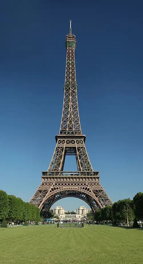 Image 18 Eiffel Tower Photo: Benh Lieu Song The Eiffel Tower as seen from the Champ de Mars. At 324 metres (1,063 ft) tall, the tower, an iron lattice tower, is the tallest building in Paris, the most-visited paid monument in the world, as well as one of the most recognizable structures in the world. Named after its designer, Gustave Eiffel, it was built as an entrance arch for the 1889 Exposition Universelle and has since become the most prominent symbol of both Paris and France. More selected pictures