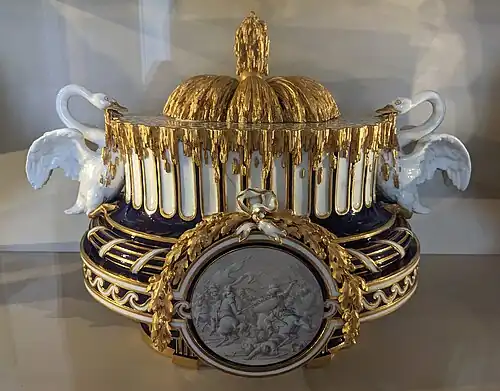 Louis XVI style vase with a medallion with garlands at the top, swans and Vitruvian scrolls, by Jean-Baptiste-Étienne Genest for Sèvres, c. 1767, soft-paste porcelain, Louvre