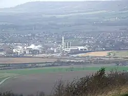 Town nestling at the foot of rolling hills