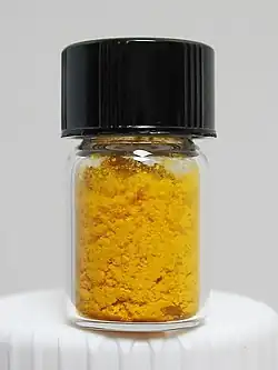 Folic acid as a yellow-orange crystalline powder
