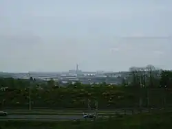 In sight are the M2, Rochester Bridge and Castle, the covered slips at Chatham Dockyard, Kingsnorth Power station and in the far distance the Grain Power Stations