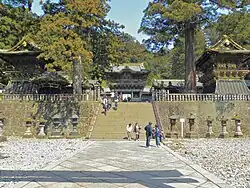 Several traditional buildings including a gate.
