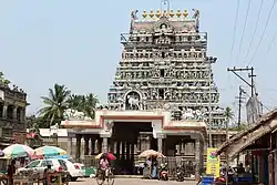 A pyramidal temple tower with sky in the background