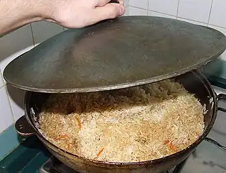 Pilaf (palaw) being prepared in a qazan