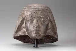 Stone head carving of Paramessu (Ramesses I), originally part of a statue depicting him as a scribe. On display at the موزه هنرهای زیبا (بوستون).