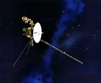 Model of the Voyager spacecraft, a small-bodied spacecraft with a large, central dish and many arms and antennas extending from it