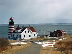 West Quoddy Head Lighthouse and Quoddy Narrows, with Grand Manan Island, کانادا in background