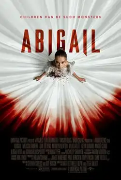 A young girl in a blood-stained white ballerina outfit looks up.