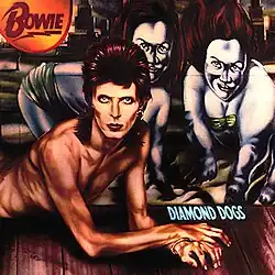 A painting of a red-haired man laying down like a dog. Two grotesque models appear behind him.